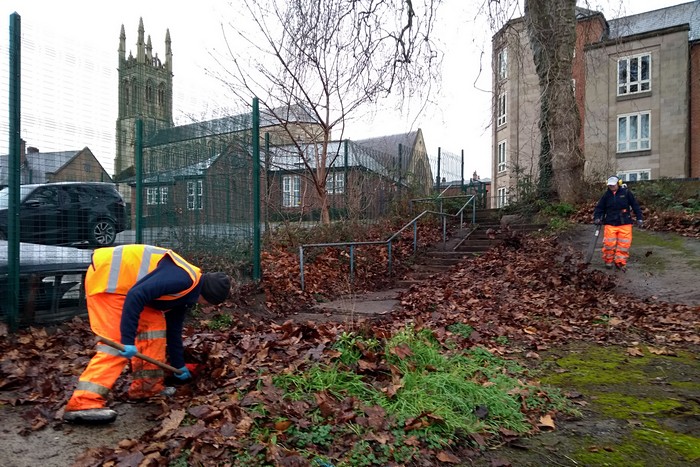 Workers from Derby Council's Streetpride clearing the steps into the green - February 2022